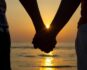couple-holding-hands-at-sunset-free-photo